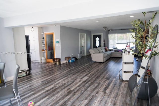 living room with dark hardwood / wood-style floors