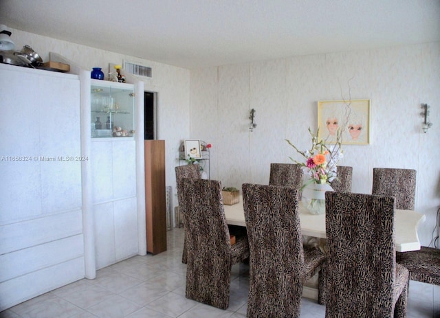 dining space with tile patterned floors