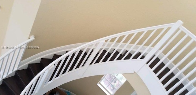 stairs featuring hardwood / wood-style floors