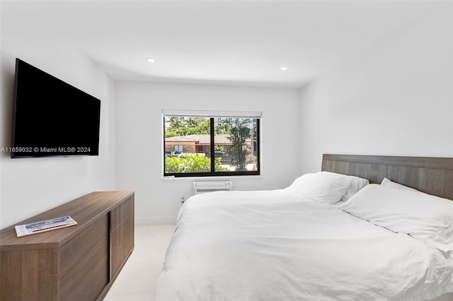 carpeted bedroom with a wall unit AC