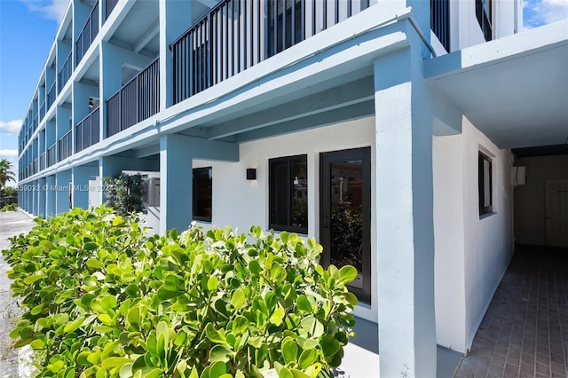 entrance to property with a balcony