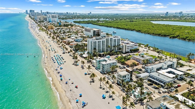 bird's eye view featuring a beach view and a water view