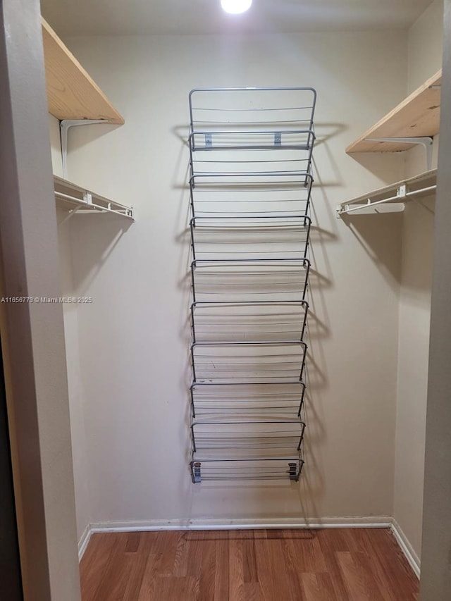 spacious closet with wood finished floors