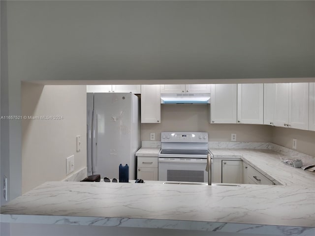 kitchen featuring white appliances, sink, light stone counters, and white cabinets