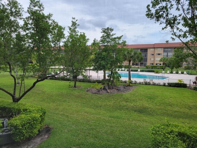 view of yard featuring a community pool