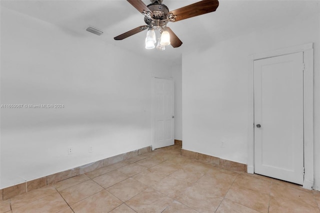 spare room with ceiling fan