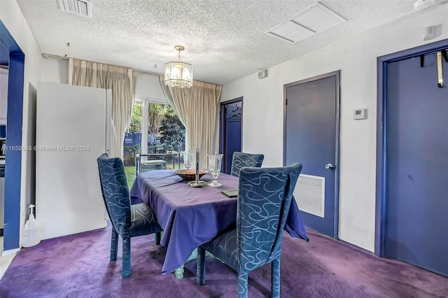 carpeted dining area featuring a chandelier and a textured ceiling