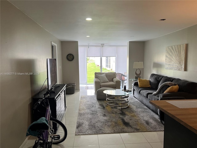 tiled living room with ceiling fan