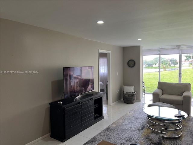 living room with light tile patterned floors and ceiling fan