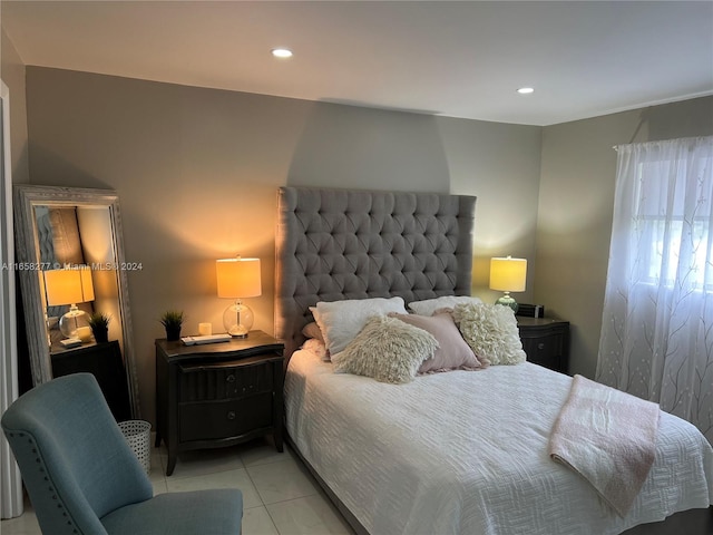 bedroom with light tile patterned floors