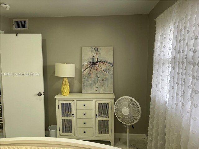 bedroom featuring tile patterned flooring