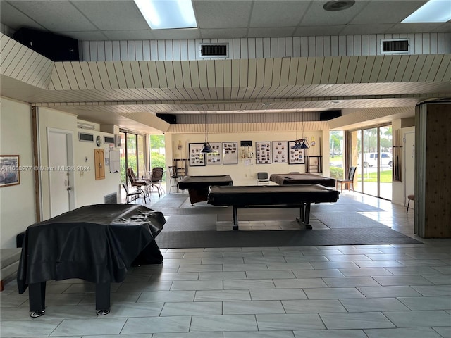 recreation room featuring billiards, a paneled ceiling, and a wealth of natural light