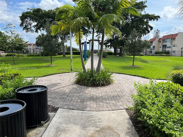 view of home's community with a yard