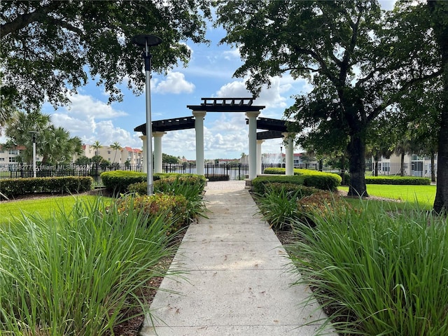 view of property's community featuring a water view and a yard