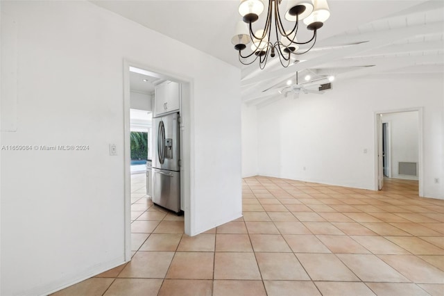 unfurnished dining area featuring vaulted ceiling with beams, light tile patterned flooring, and ceiling fan with notable chandelier