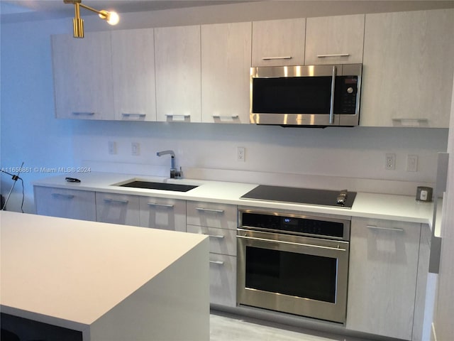 kitchen featuring appliances with stainless steel finishes and sink