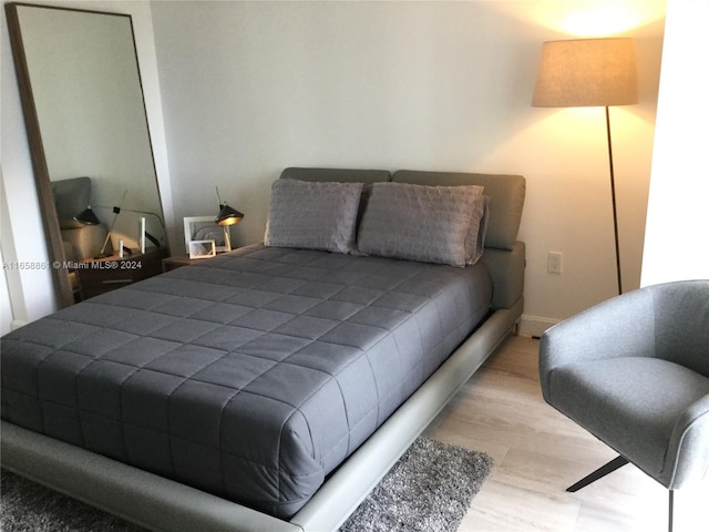 bedroom with light hardwood / wood-style floors