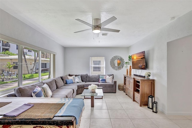 living room with light tile patterned flooring and ceiling fan