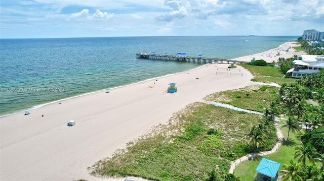 aerial view featuring a view of the beach and a water view