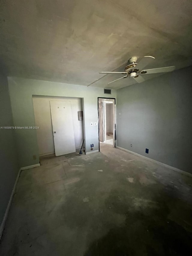 spare room with concrete flooring and ceiling fan