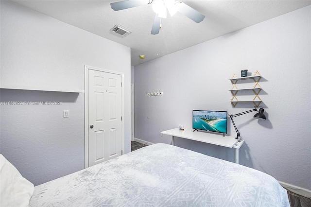 bedroom with ceiling fan and hardwood / wood-style floors