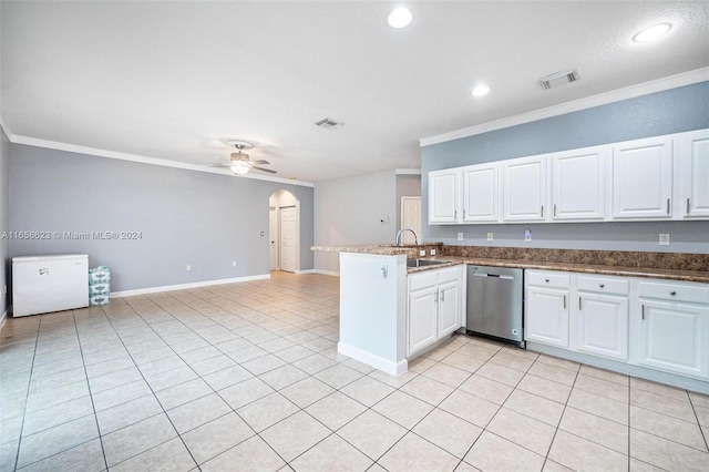 kitchen with dishwasher, ceiling fan, kitchen peninsula, and white cabinetry