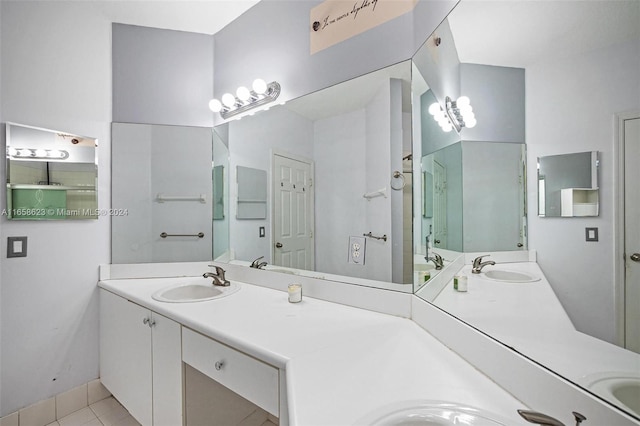 bathroom with tile patterned flooring and vanity