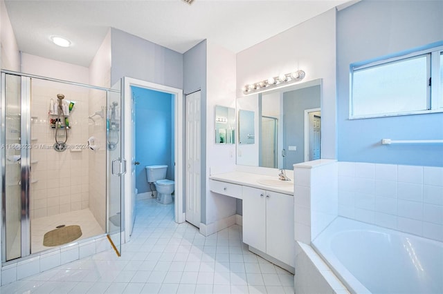 full bathroom featuring vanity, toilet, independent shower and bath, and tile patterned floors