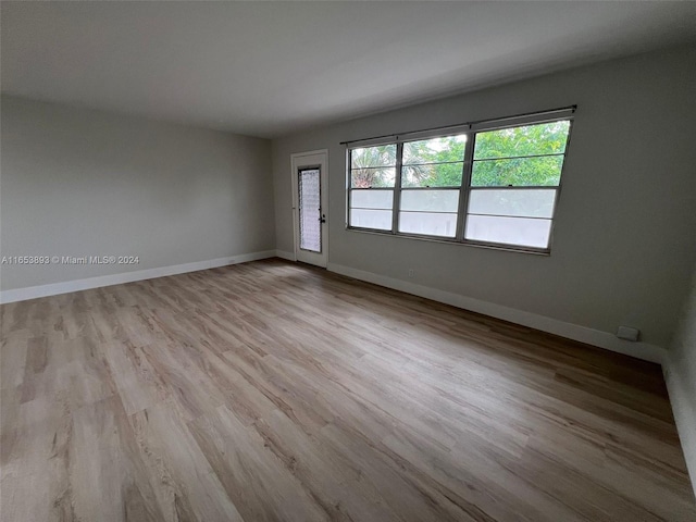 spare room featuring light hardwood / wood-style flooring