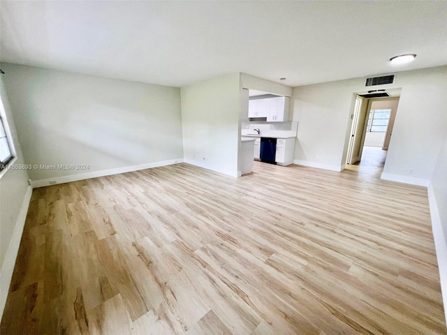 unfurnished living room featuring light hardwood / wood-style floors