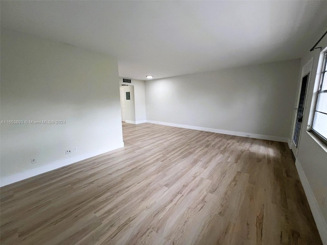 empty room with light hardwood / wood-style floors