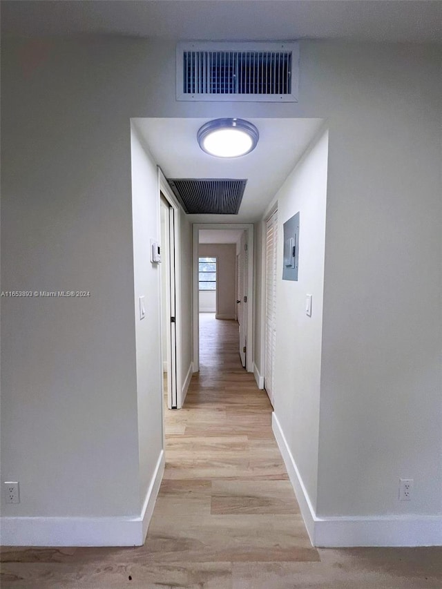 hall with light hardwood / wood-style floors