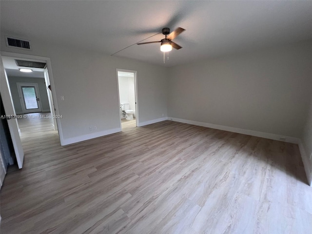 spare room with light hardwood / wood-style floors and ceiling fan