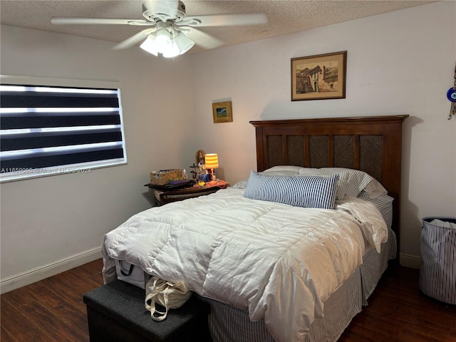 bedroom featuring a textured ceiling, dark hardwood / wood-style flooring, and ceiling fan