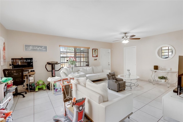 living room with light tile patterned floors and ceiling fan