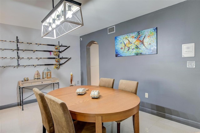 dining space with a chandelier