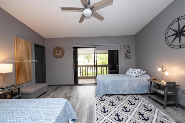 bedroom featuring access to exterior, ceiling fan, vaulted ceiling, and hardwood / wood-style flooring