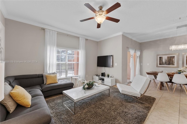 living room featuring crown molding, light tile patterned floors, and ceiling fan