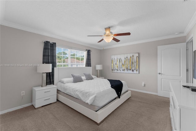 carpeted bedroom featuring ceiling fan, crown molding, and a textured ceiling