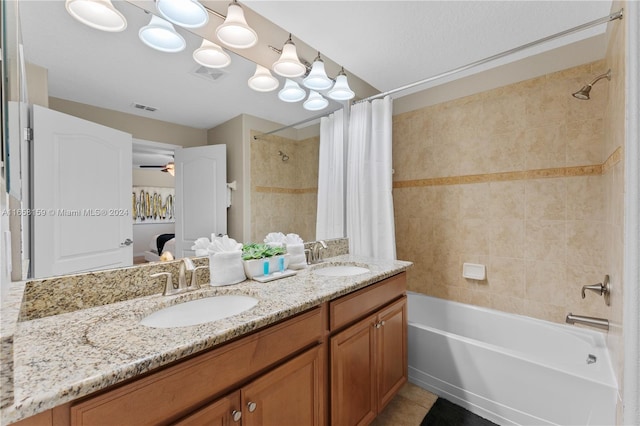 bathroom with vanity, shower / tub combo with curtain, ceiling fan, and tile patterned floors