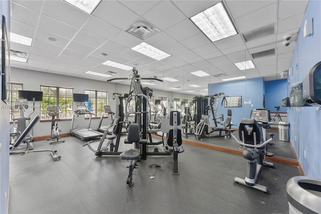 gym featuring a paneled ceiling