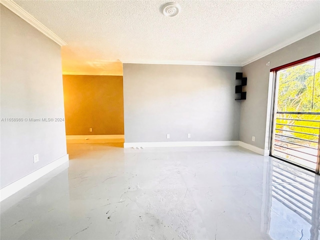 empty room with crown molding and a textured ceiling