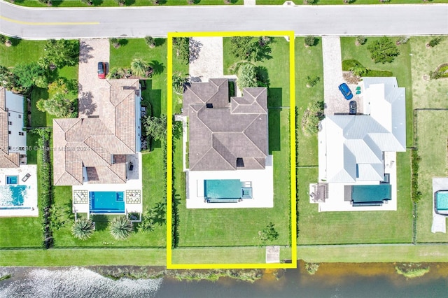 birds eye view of property with a water view