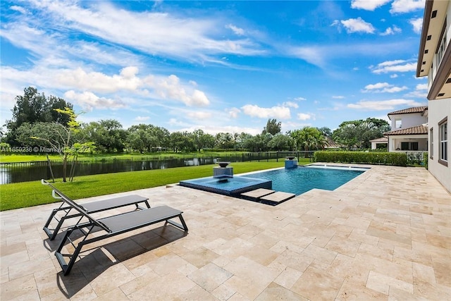 view of pool with a patio area, a lawn, and a water view