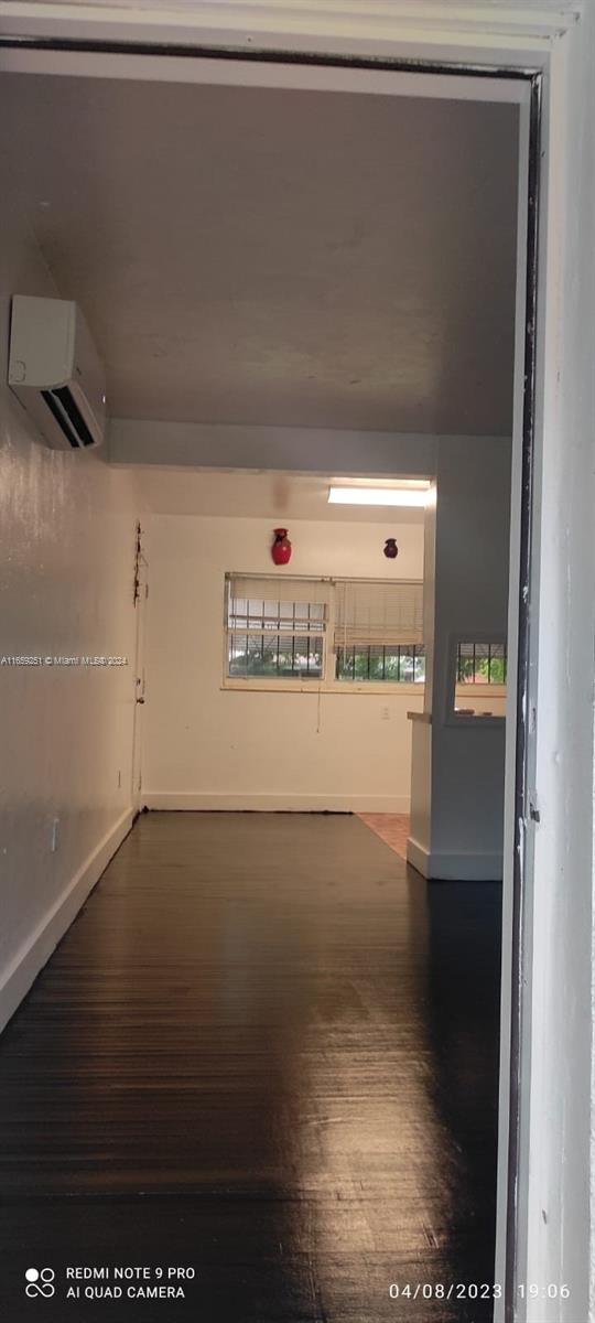 interior space featuring a wall mounted air conditioner