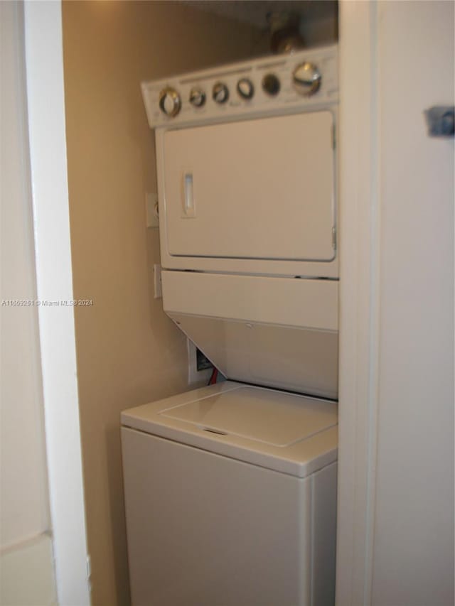 laundry room featuring stacked washer / dryer