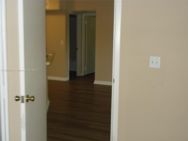 hall featuring dark wood-type flooring