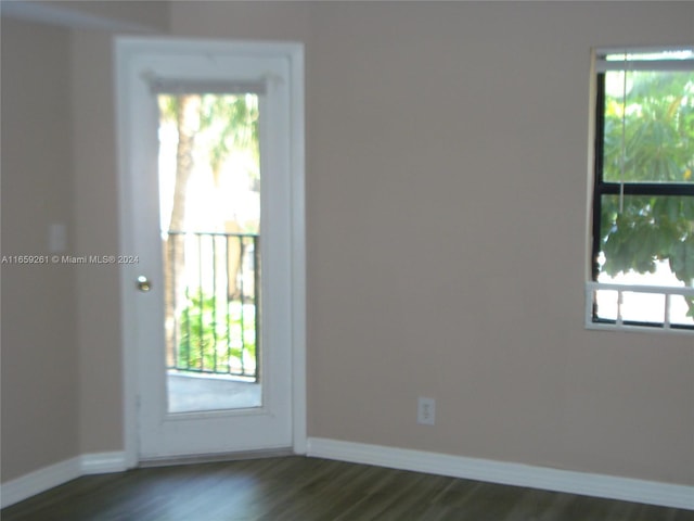 spare room featuring dark hardwood / wood-style floors