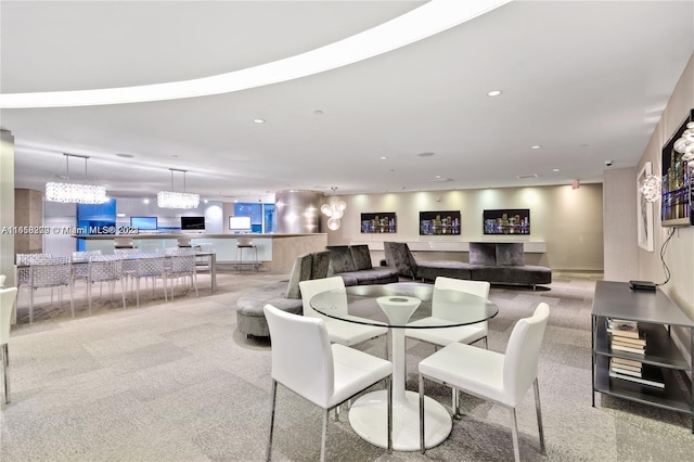 dining space featuring light colored carpet