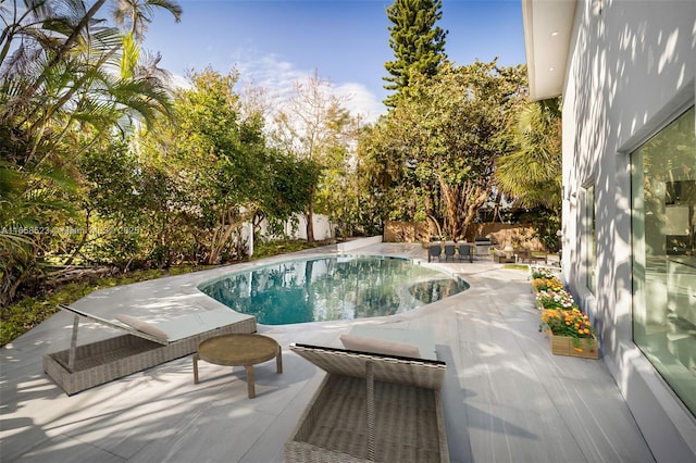 view of pool featuring a fenced in pool and a patio